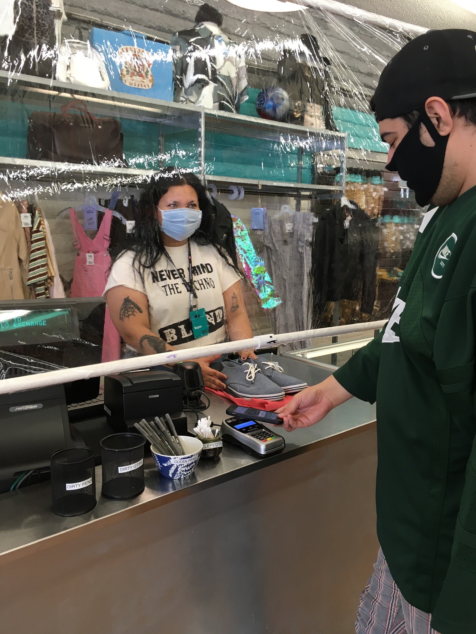 Buffalo Exchange Tempe Customer Checking Out with Contactless Payment Options