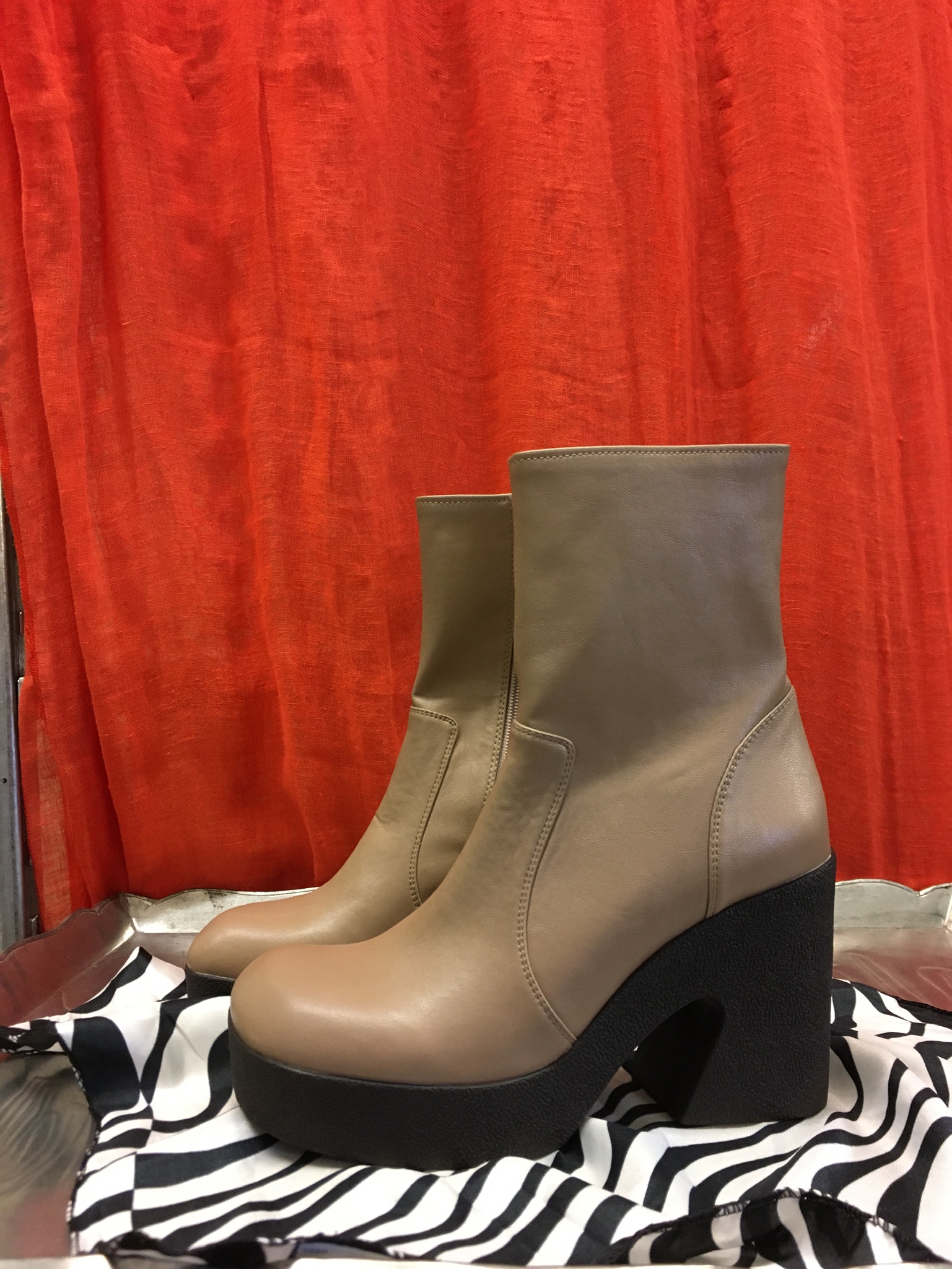 AZ1 Jeffrey Cambell Boots Taupe platform Jeffrey Campbell boots sitting on top of zebra print scarf