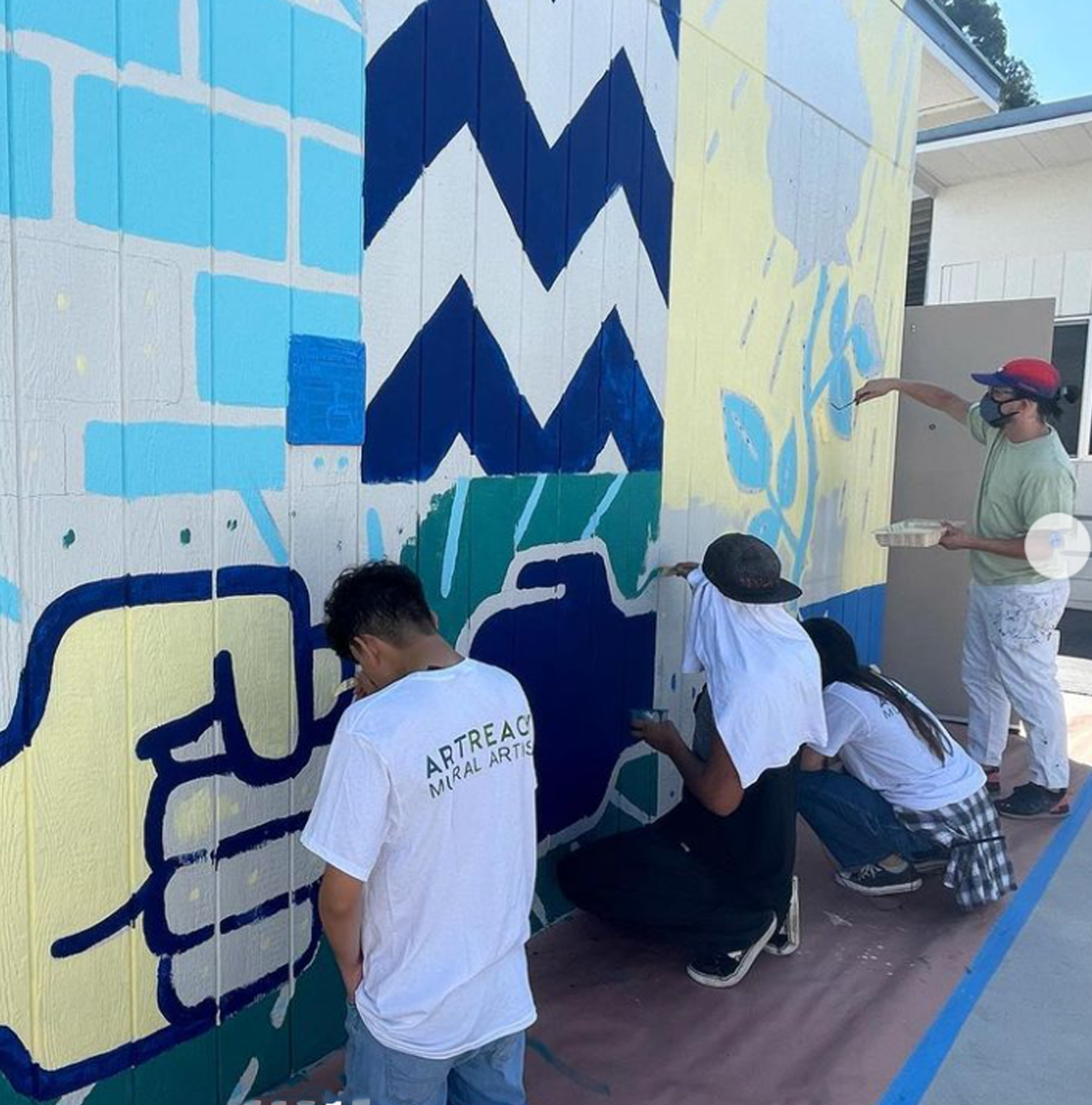 4 people painting mural for Artreach San Diego