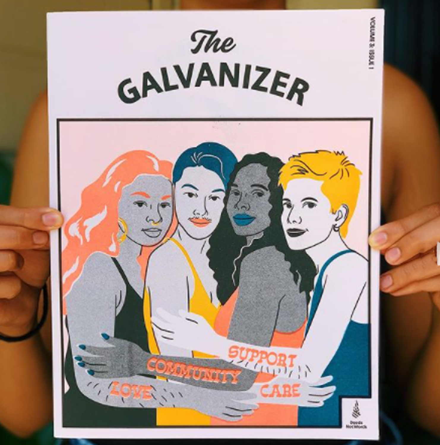 Close-up of person holding The Galvanizer magazine