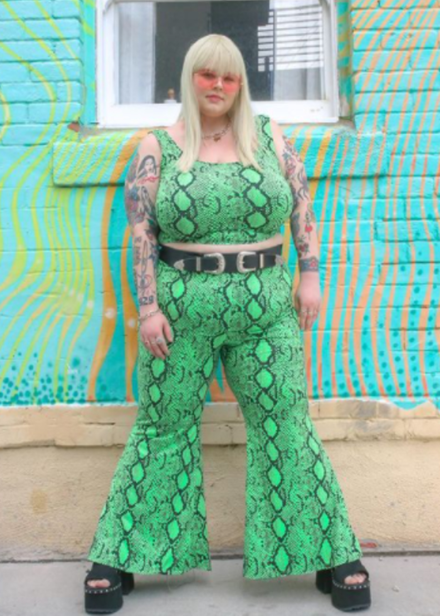 Caelyn wearing a snake print matching set