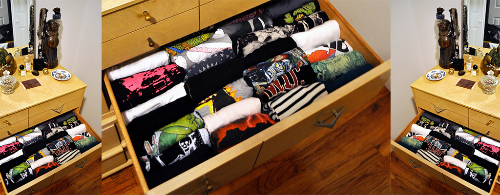 T-shirts folded up and inside a drawer