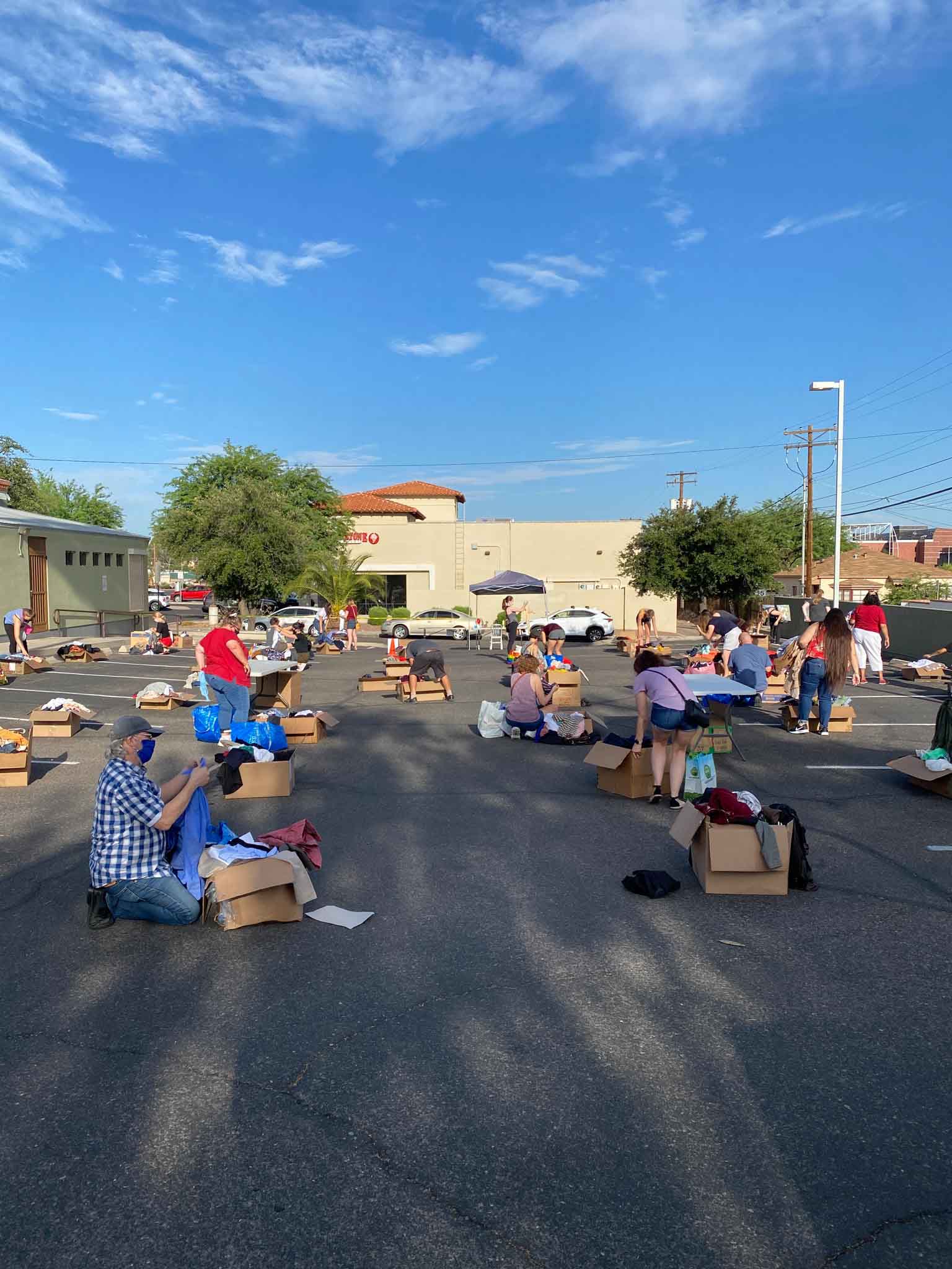 Customers social distancing and shopping the $1 sale at Buffalo Exchange Tucson parking lot