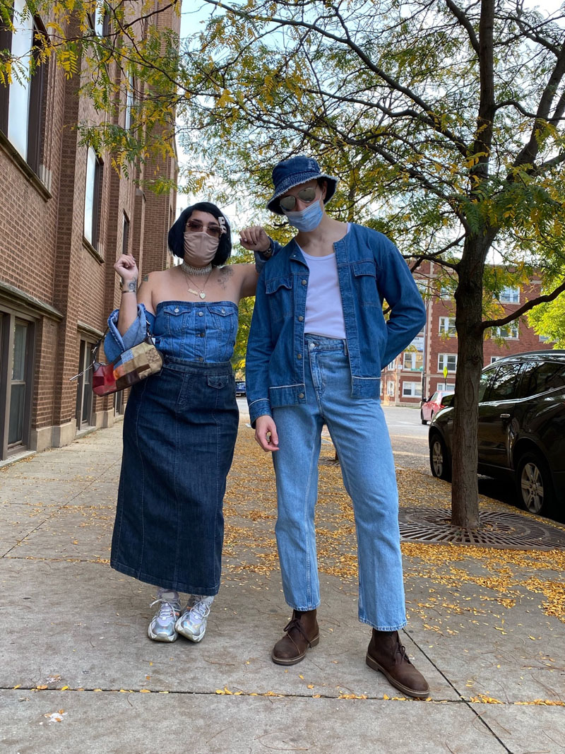 Two people in Britney Spears and Justin Timberlake costumes wearing head-to-toe denim outfits.