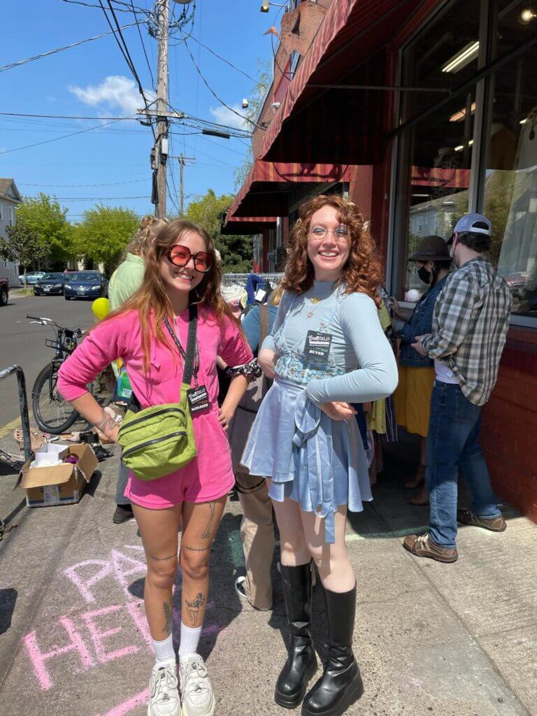 Two Buffalo Exchange Employees outside the Earth Day $1 Sale in 2022
