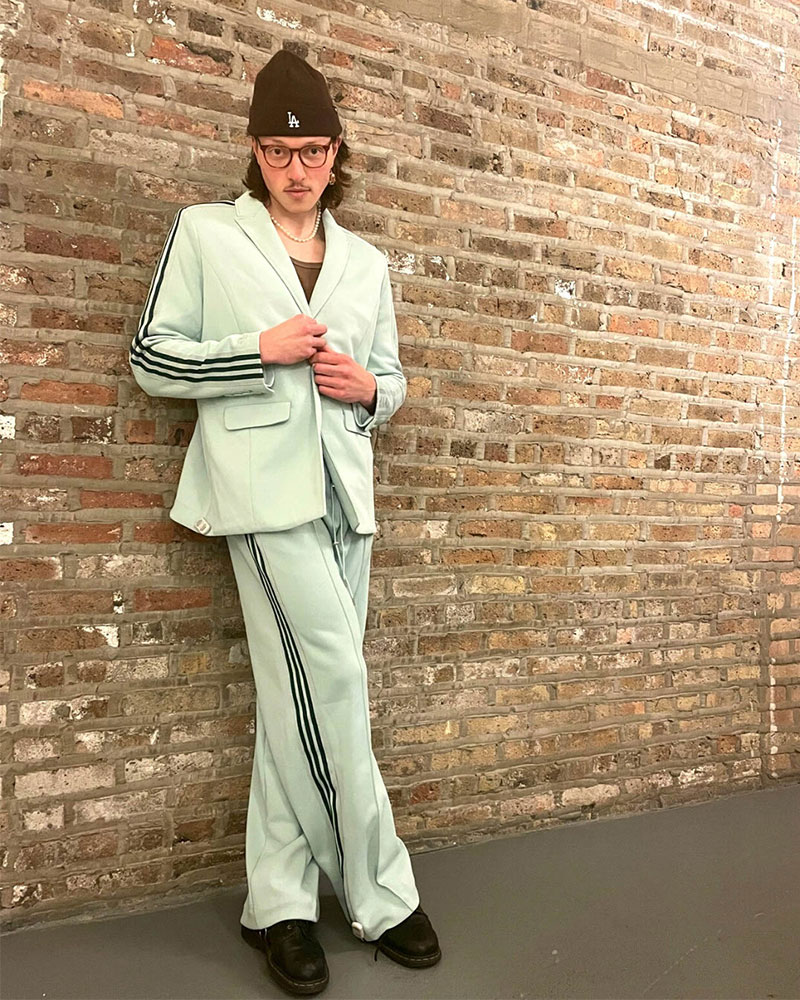 Person wearing mint green Adidas suit