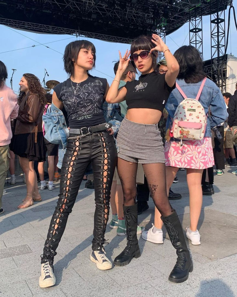 @calderon.twins in similar all-black alt looks, wearing graphic tees and leather pants and accessories,