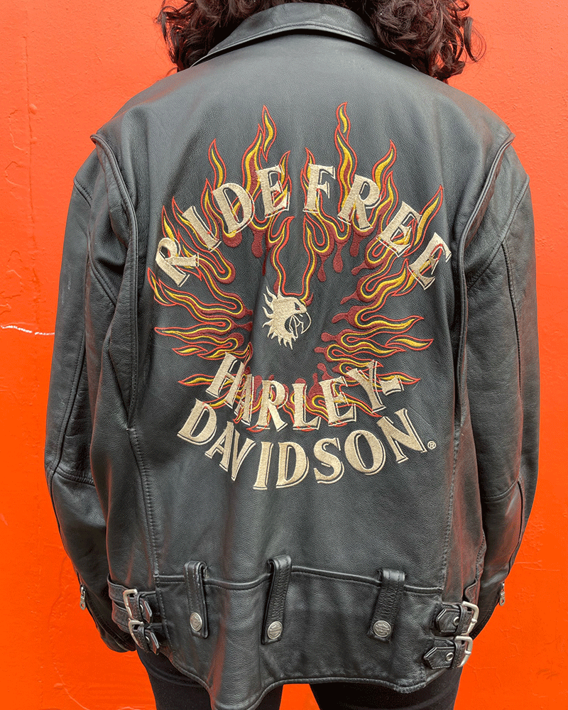 Back of vintage Biker jacket that reads ride free Harley davidson