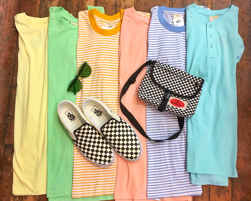 various brightly colored t-shirts with checkered vans and bag