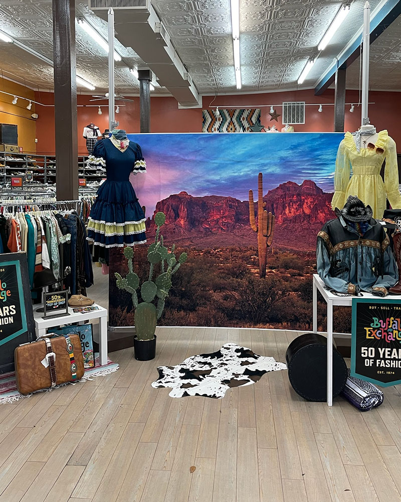 Desert photo backdrop with western mannequins