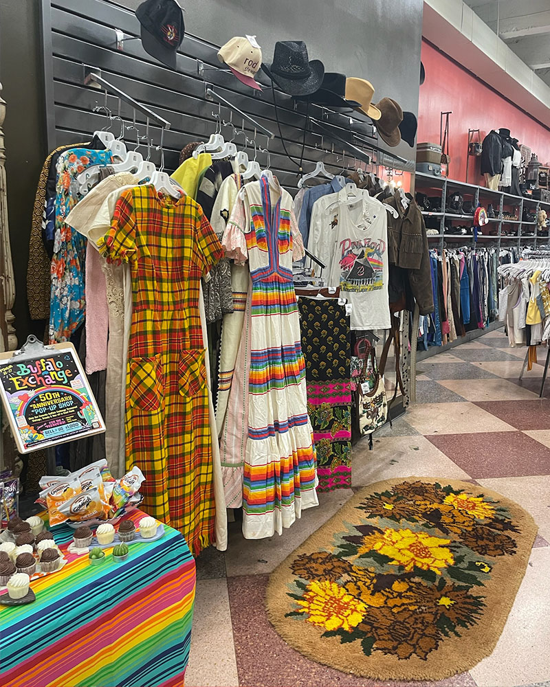 Vintage boutique pop-up shop with colorful dresses 