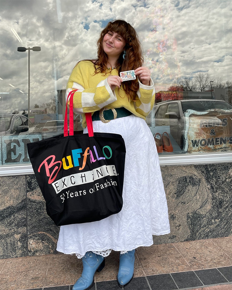 A Buffalo customer holding a trade card