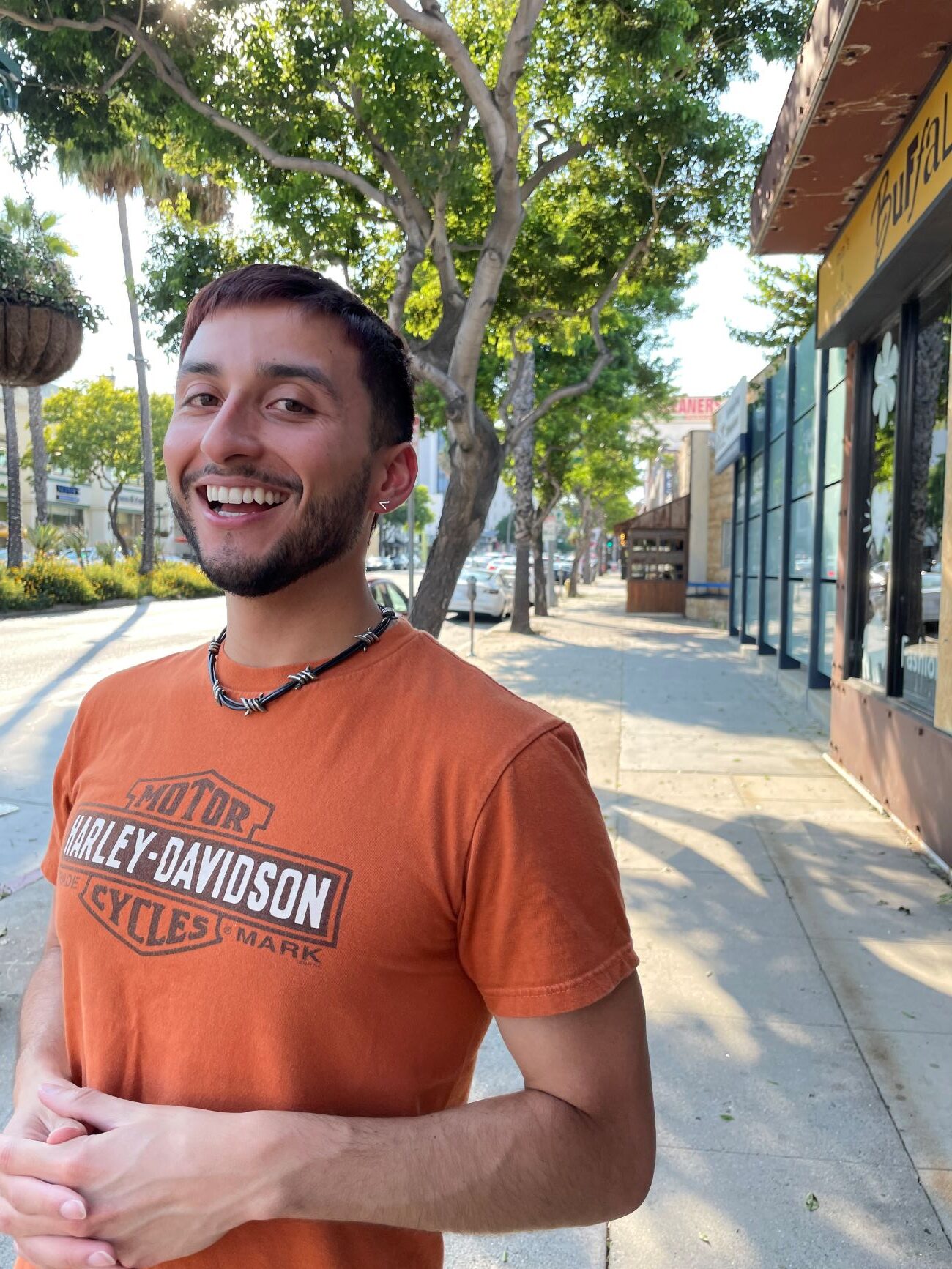 Alex posing on a street