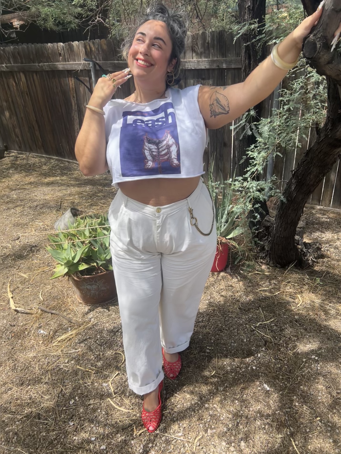 Screenshot Employee Bianca posing outside next to a tree