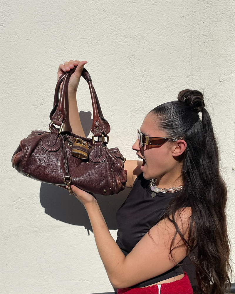 citybag Natasha outside of a Buffalo Exchange