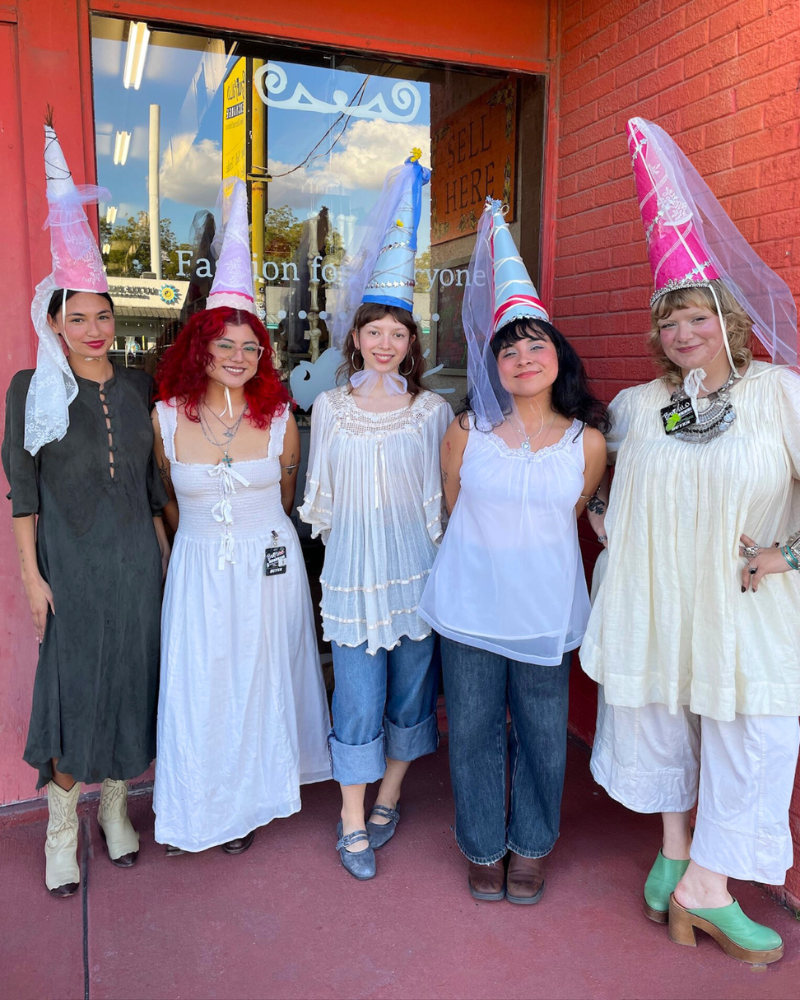 1 Group of girls in flowy linen clothes and pointed princess hats