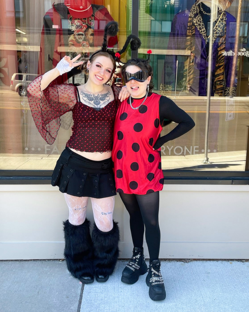 4 Two Buffalo Employees in polka dots with antennae, posing outside the store.