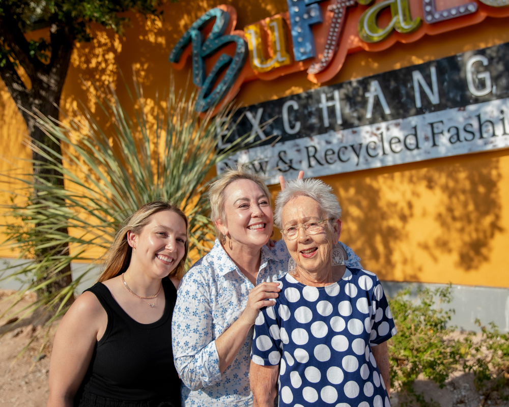 Untitled design (3) Three generations of the Block family pose for photo near Buffalo Exchange Tucson store sign