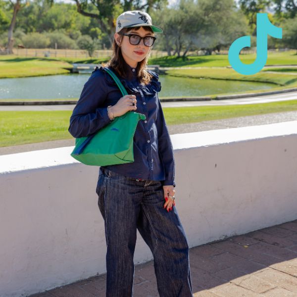 person standing in all denim outfit with tiktok logo overlay