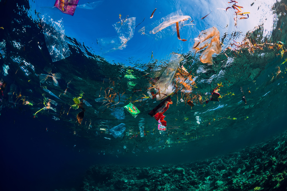 Underwater photograph of plastic trash floating in the ocean
