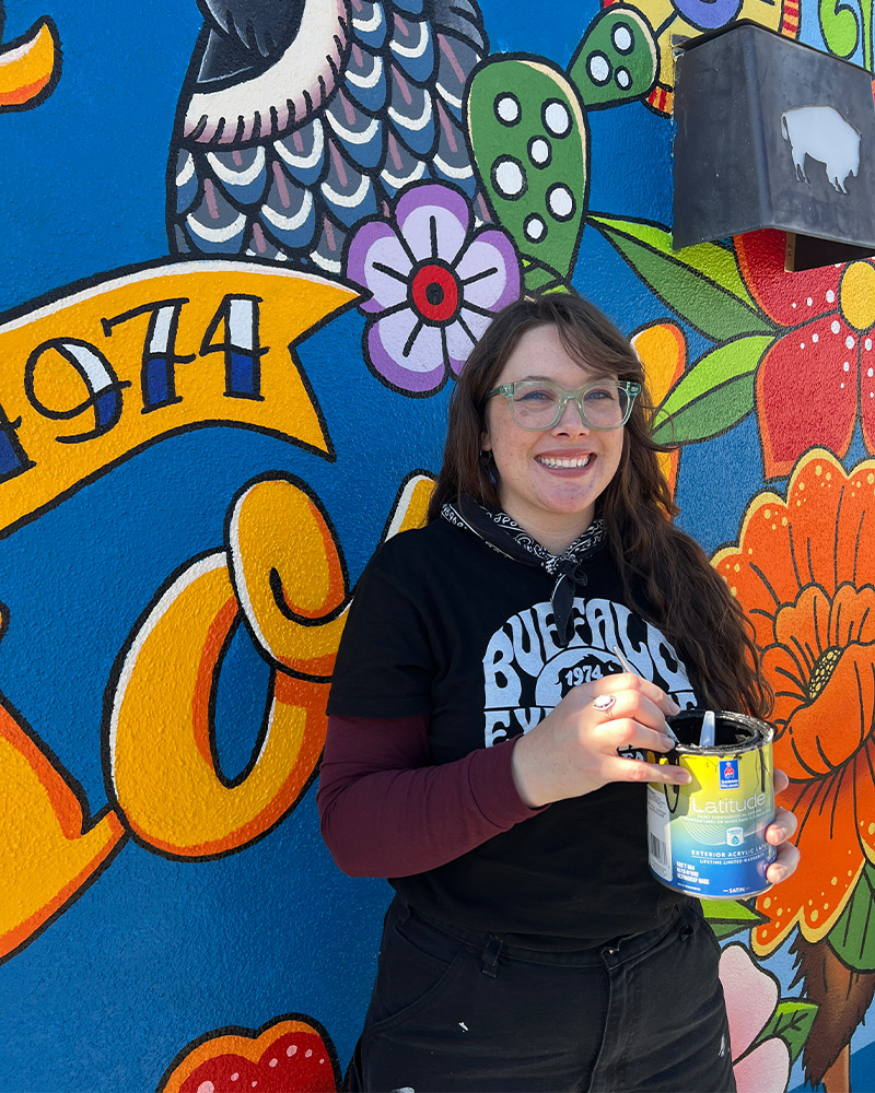 Three generations of the Block family pose for photo near Buffalo Exchange Tucson store sign