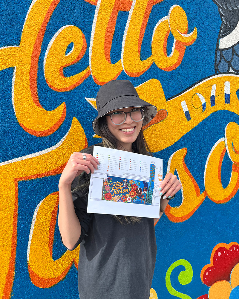 Three generations of the Block family pose for photo near Buffalo Exchange Tucson store sign