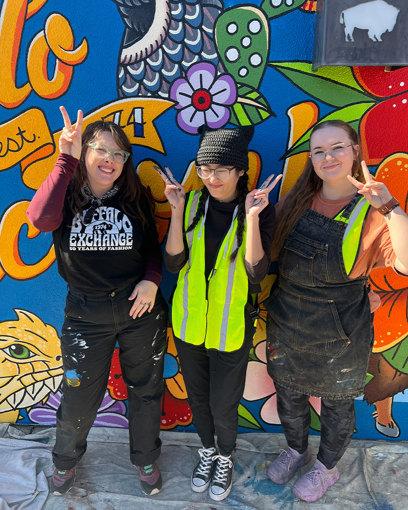 Vintage photo of Kerstin Block holding up a colorful piece of clothing