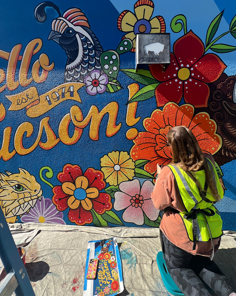 Three generations of the Block family pose for photo near Buffalo Exchange Tucson store sign