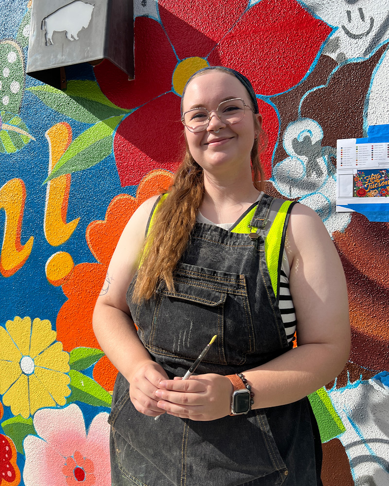 Three generations of the Block family pose for photo near Buffalo Exchange Tucson store sign