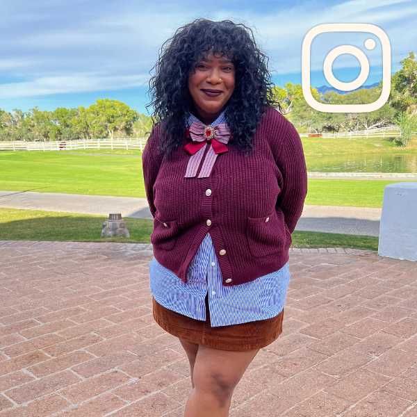 Person with alt prep style wearing a purple cardigan with a large bow at the neck over a pinstripe button down paired with a brown corduroy mini skirt