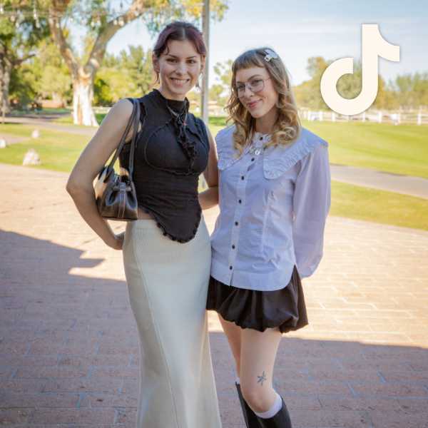 Two people with alt style wearing minimalist outfits of contrasting black and white tops and skirts with ruffle details, TikTok logo overlay at top right.