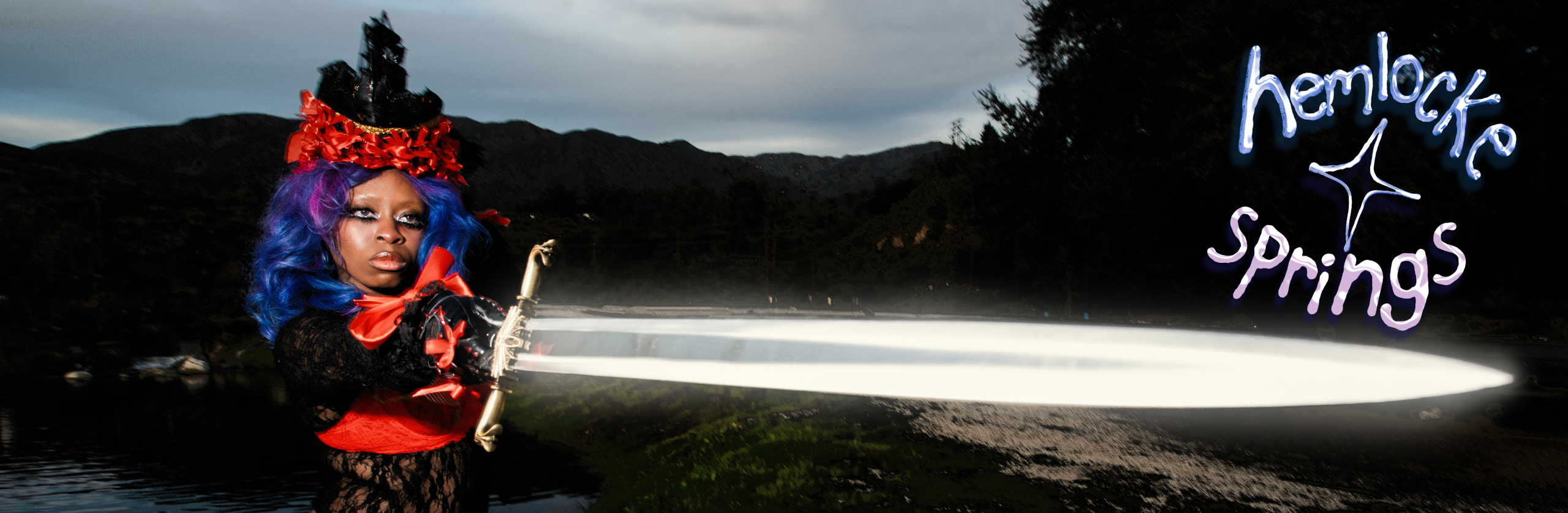 hemlocke springs holding sword with hemlocke springs circular logo